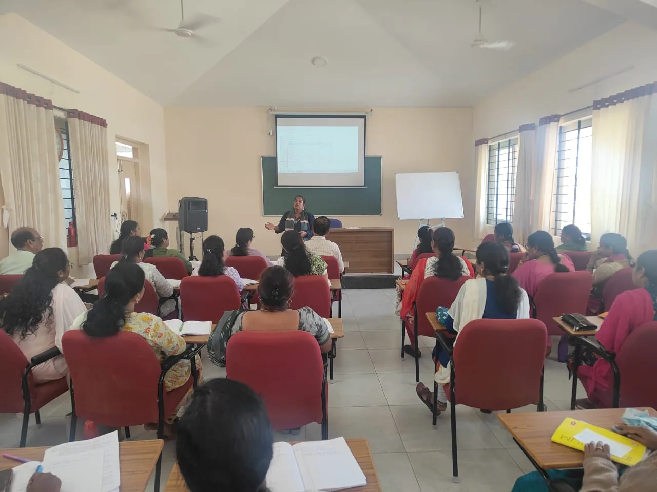 Mrs. Rita Marshall conducting a Faculty Development Program session with college educators in a classroom setting